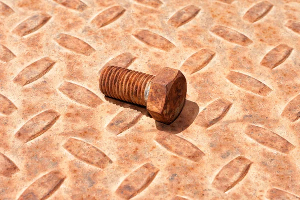 Rusty metal plate and bolt — Stock Photo, Image
