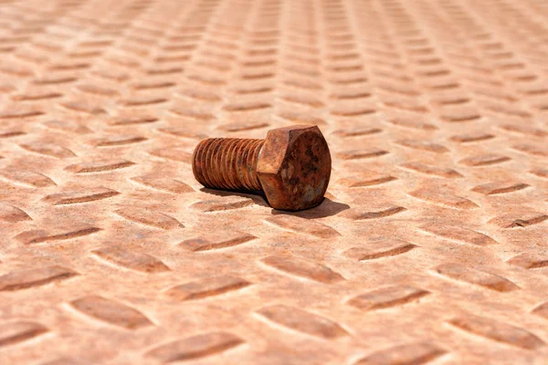 Rusty metal plate and bolt — Stock Photo, Image