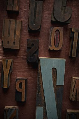 Vintage letters on wooden background clipart