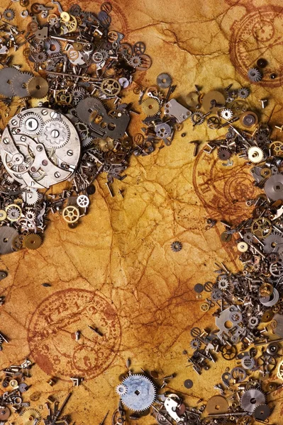 The old gears on the textured paper — Stock Photo, Image