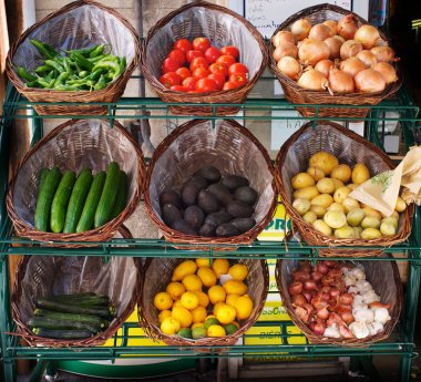 Vegetables in baskets on market place clipart