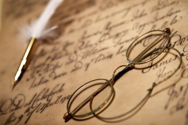 Old glasses on vintage letter clipart