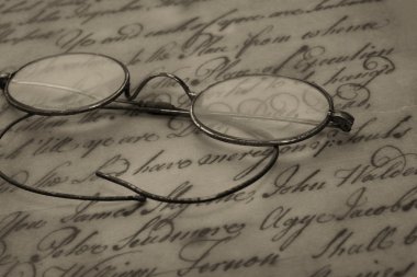 Old glasses on the vintage document clipart