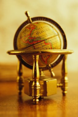 Vintage globe on a table clipart