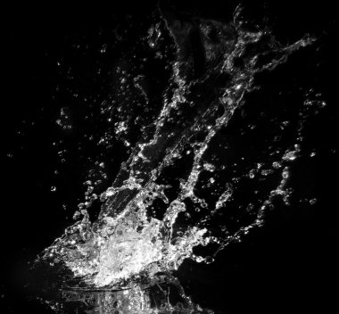 Water splash isolated on black background clipart