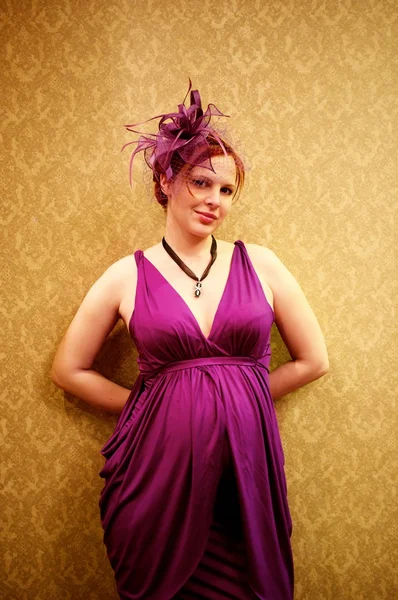 stock image Beautiful redhead woman in purple dress