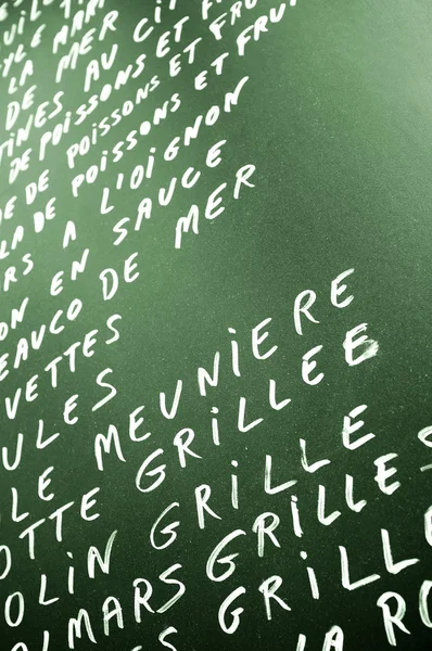 Green chalkboard with menu — Stock Photo, Image