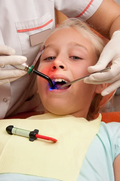 Teenage girl at a dentist. — Stock Photo, Image