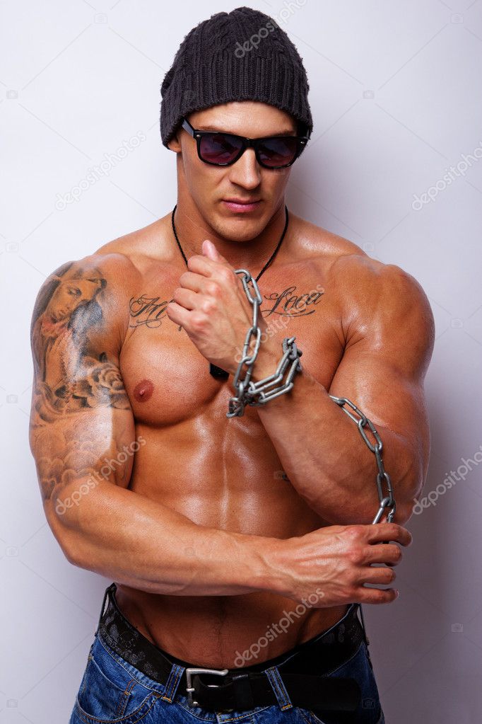 Portrait of muscle man with chain