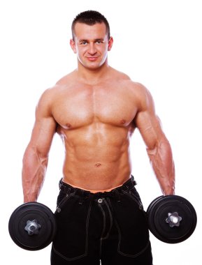 Portrait of man in gym doing exercise clipart