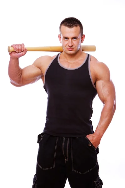 Portret van sterke man poseren in studio met bat — Stockfoto