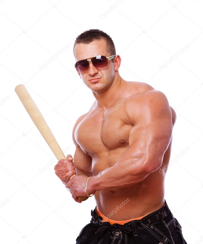 Portrait of strong man playing baseball