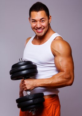 Portrait of young man lifting weights clipart