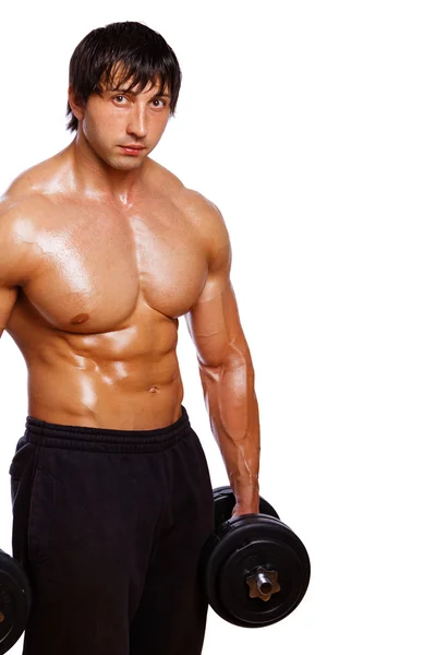 Retrato del hombre musculoso posando sobre fondo blanco con pesas — Foto de Stock