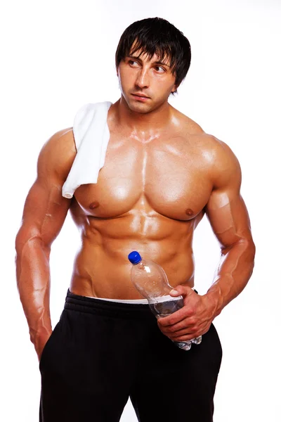 Portrait of muscle man with bottle — Stock Photo, Image
