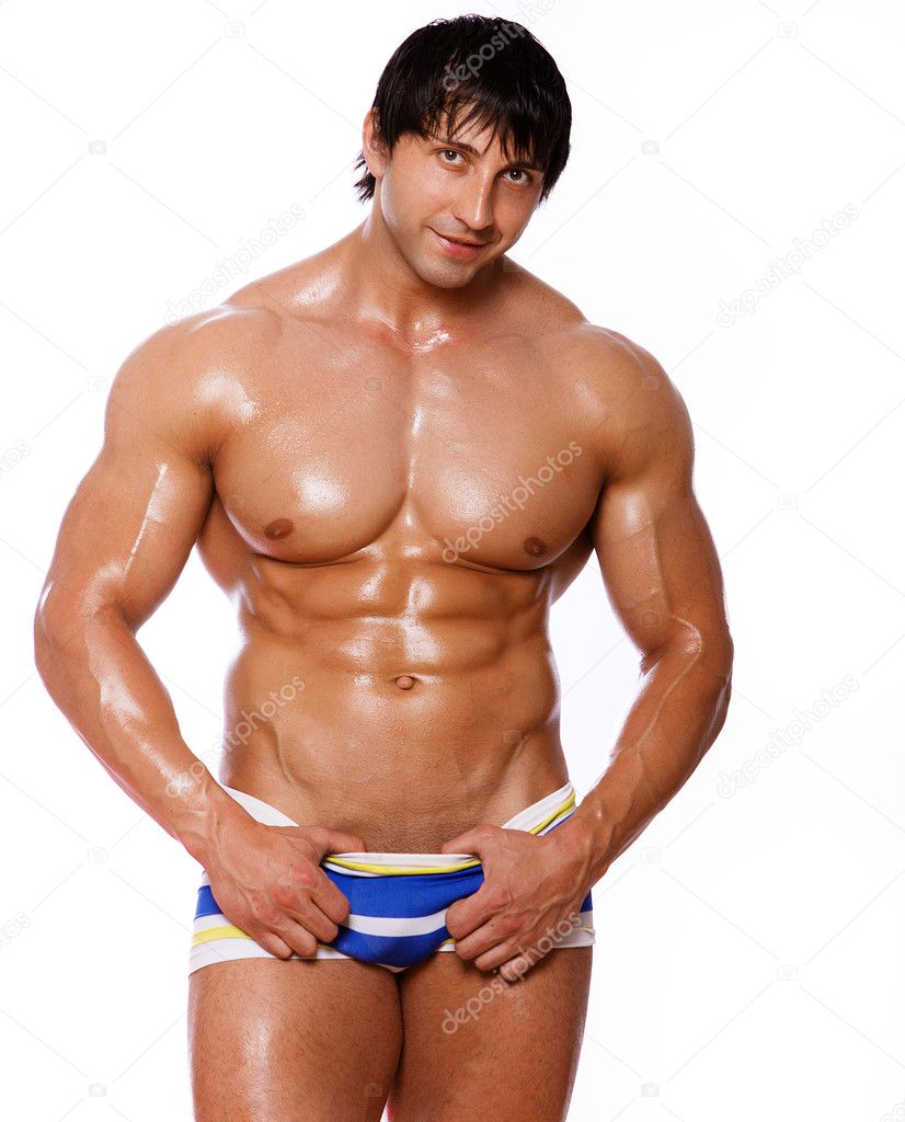 Portrait of muscle man posing in studio on white background