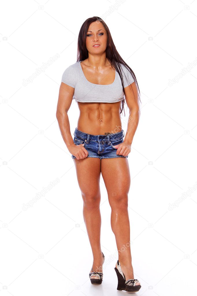 Portrait of muscle woman posing in gym