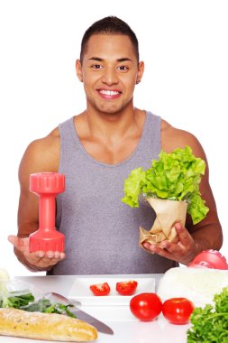 Portrait of healthy man posing in studio with salad clipart