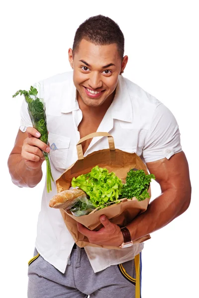 Portret van man poseren in studio met groenten — Stockfoto