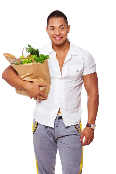 Porträt eines gutaussehenden Mannes, der auf weißem Hintergrund mit Essen posiert — Stockfoto