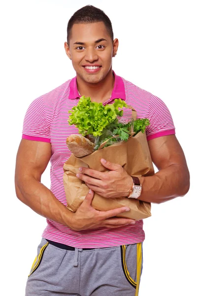Porträt eines gutaussehenden Mannes, der auf weißem Hintergrund mit Essen posiert — Stockfoto