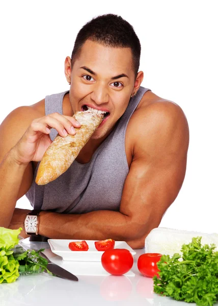 Portrait of eating man in the studio — Stock Photo, Image