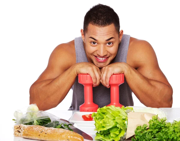 Portrait of healthy man posing in studio with dumbbells — Stock Photo, Image