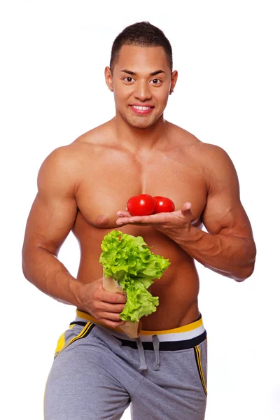 Portrait of healthy man posing in studio with food — Stock Photo, Image