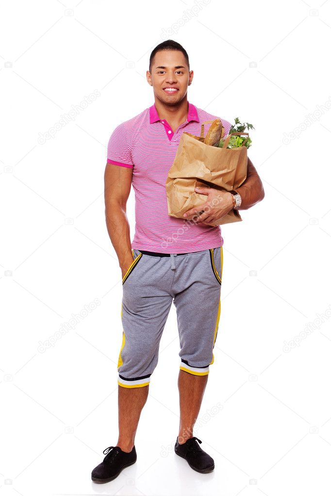 Portrait of handsome man posing on white background with food