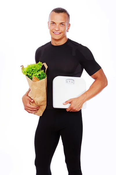 Retrato de homem sexy posando em estúdio com legumes — Fotografia de Stock
