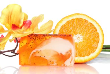 Spa concept, peach soap, flower and fresh orange clipart
