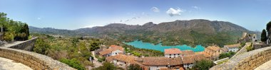 Guadalest in Spain. Panorama of the castle and the mountains. clipart