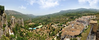 Guadalest in Spain. Top view of the castle and the mountains. clipart