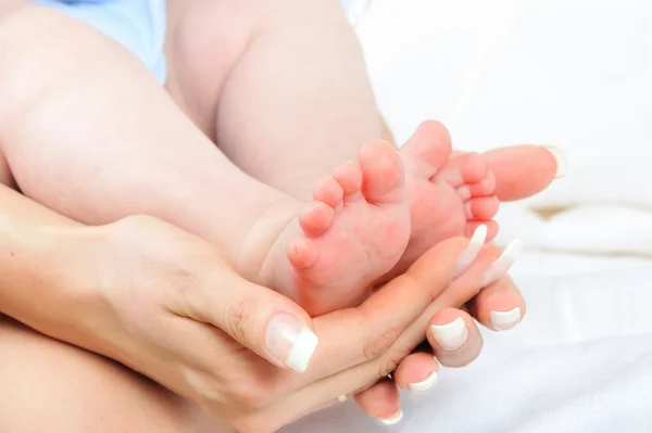 stock image Mother holding her Baby's feet.