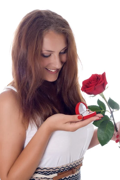 Girl holding jewellery gift box and flower. — Stock Photo, Image