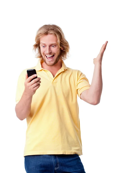 Junger Mann mit Handy lizenzfreie Stockfotos