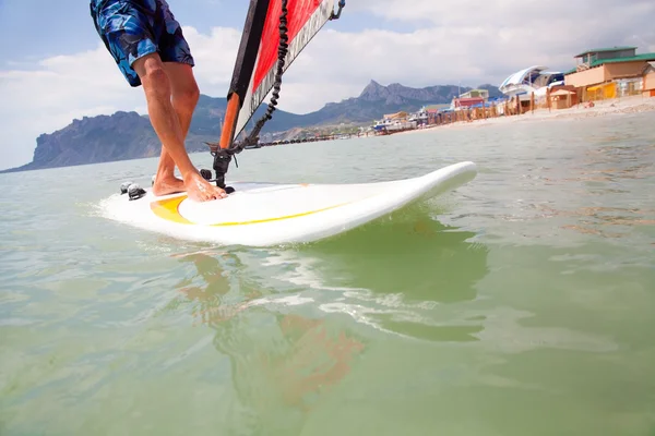 Feet on the board of windsurfing — Stock Photo, Image
