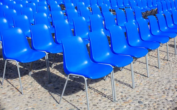 Empty blue chairs for outdoor cinema