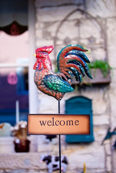 Welcome sign with iron rooster — Stock Photo, Image