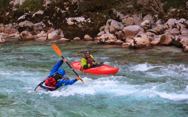 Kayaking on the Soca river, Slovenia clipart
