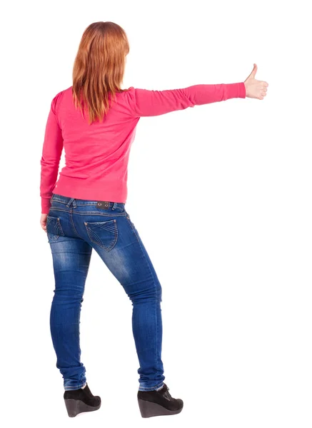 Back view of young beautiful woman going thumb up. — Stock Photo, Image