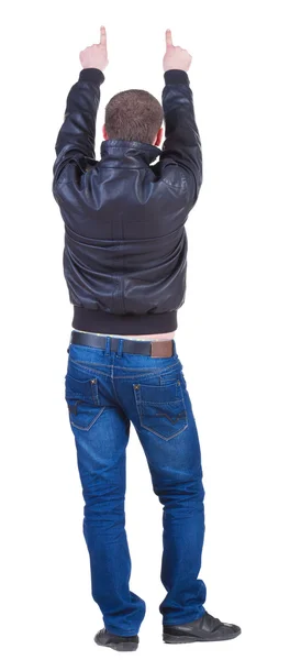 Назад точка зрения указывающего человека в джинсах и жакете — стоковое фото