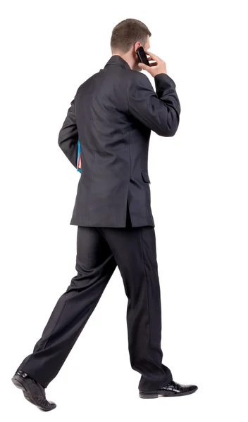 ビジネスの男を歩いての背面図 — ストック写真