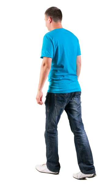 Οπίσθια όψη του περπατήματος όμορφος άνδρας στο t-shirt. — Φωτογραφία Αρχείου