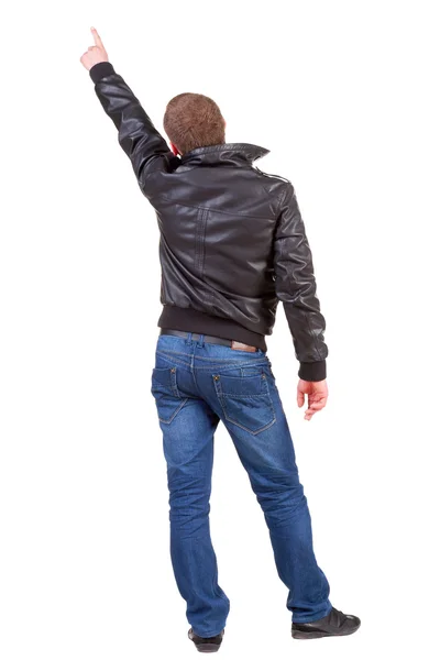 Back view of man in jacket pointing. — Stock Photo, Image