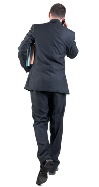ビジネスの男性との本歩行の背面図. — ストック写真