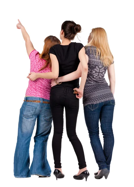 Widok grupa młodych kobiet, wskazując z tyłu . — Zdjęcie stockowe