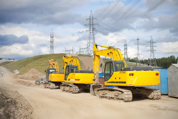 Three excavators — 스톡 사진