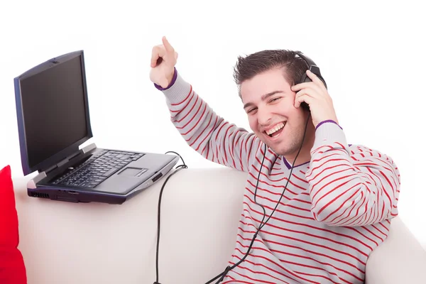 Young man listening to music Stock Image