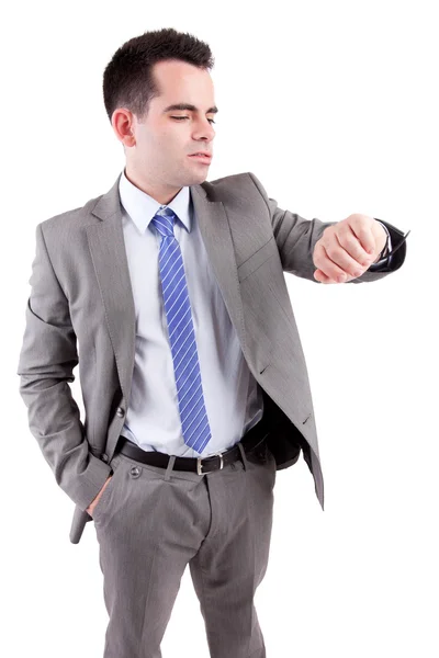 Young business man consulting his watch — Stock Photo, Image
